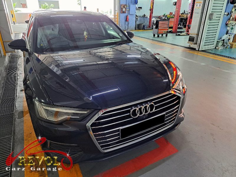 Audi A6 parked at the workshop for servicing and suspension work.