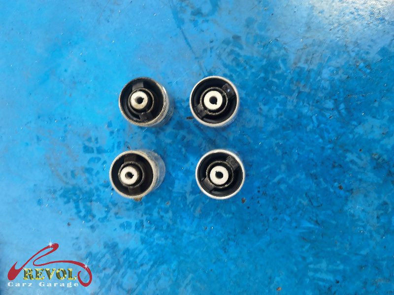 The worn upper control arm with play in its bushing flagged on the check.