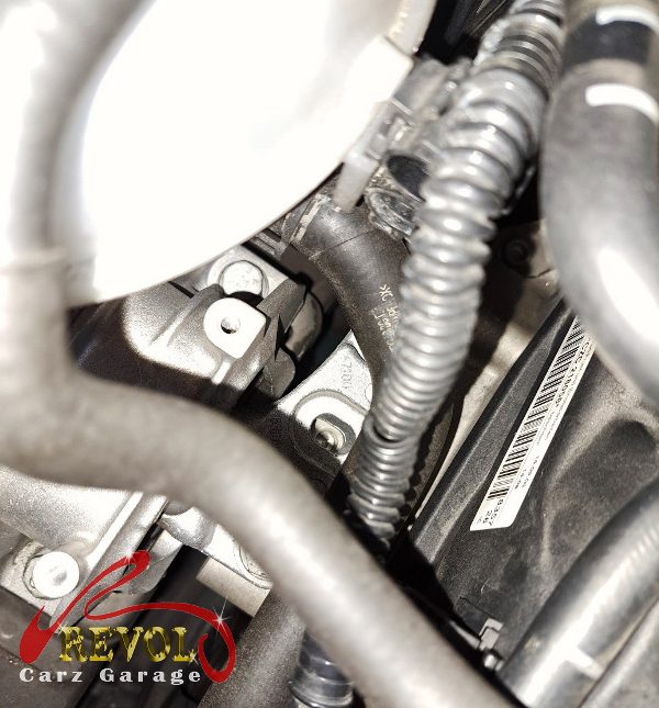 The old ignition coils and worn spark plugs removed.