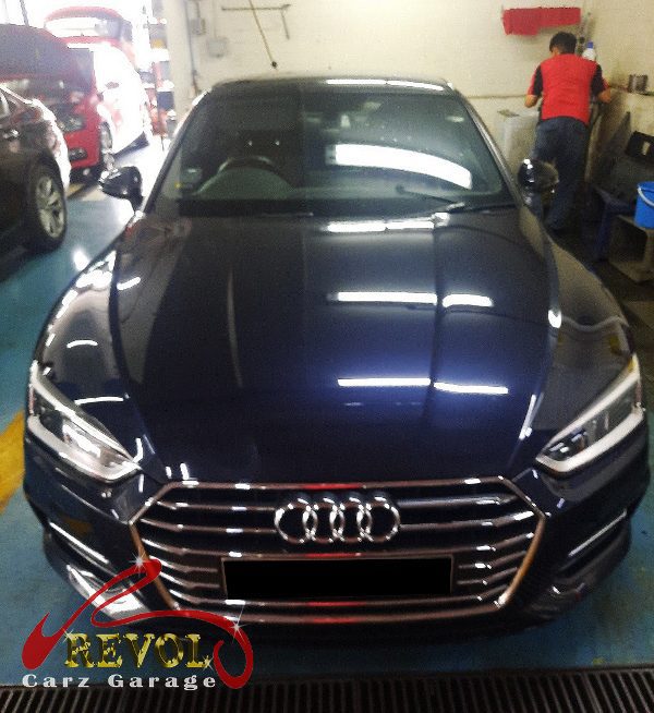 Audi A6 parked at the workshop for servicing.