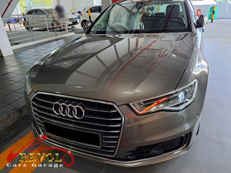 Audi A6 parked at the workshop for maintenance servicing.