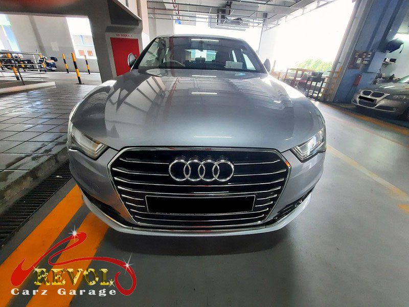 Audi A6 parked at the workshop, in for front brake inspection.