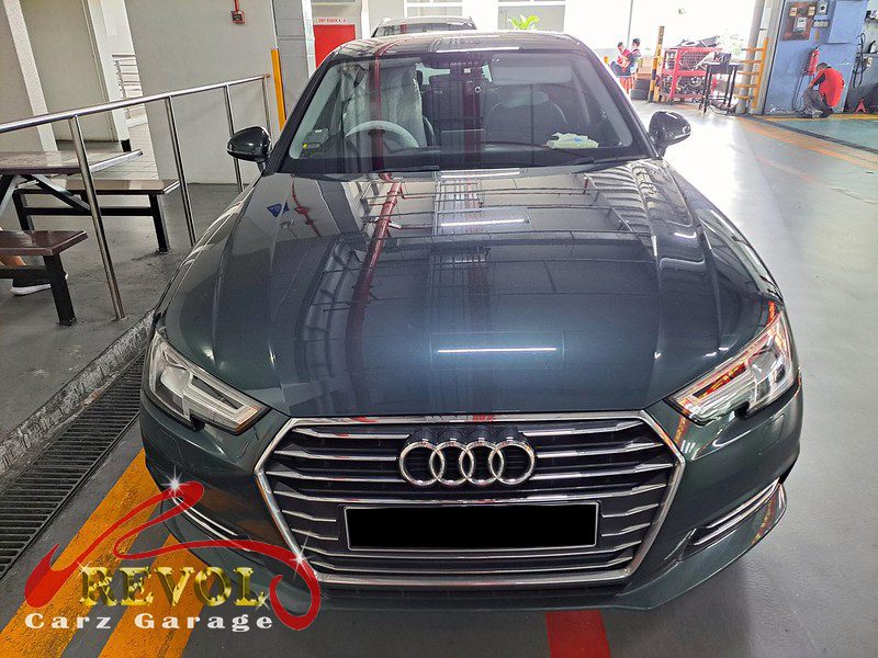 Audi A4 parked at the workshop, in for rear shock absorber inspection.