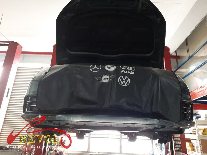 The worn rear shock absorber on the Audi A4, weeping and weak.