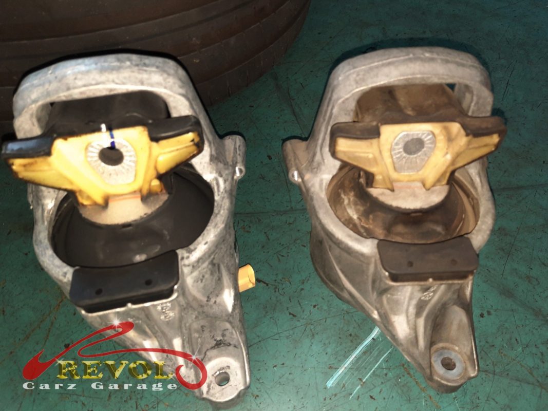 The gearbox mount removed showing the play under load.