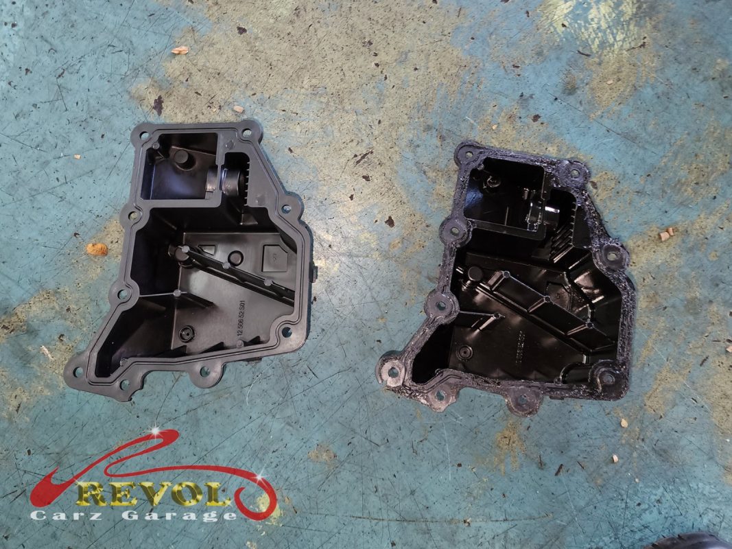 The old oil separator removed from the engine.