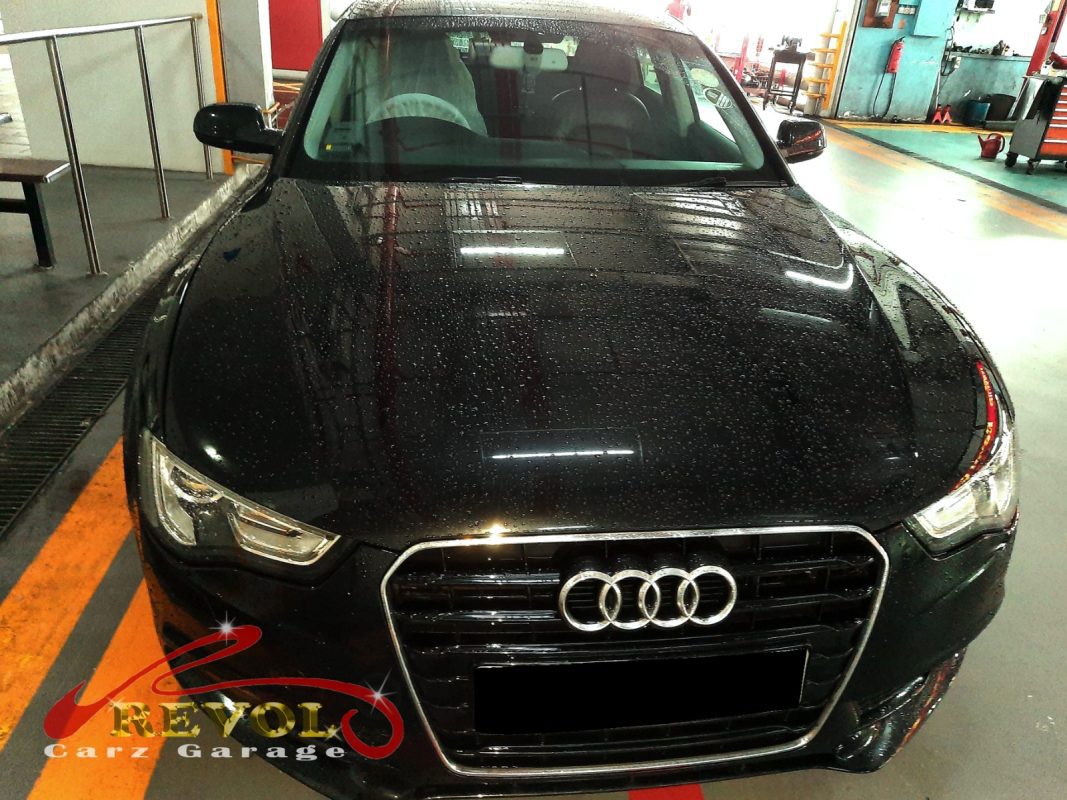 Audi A5 parked at the workshop for servicing.