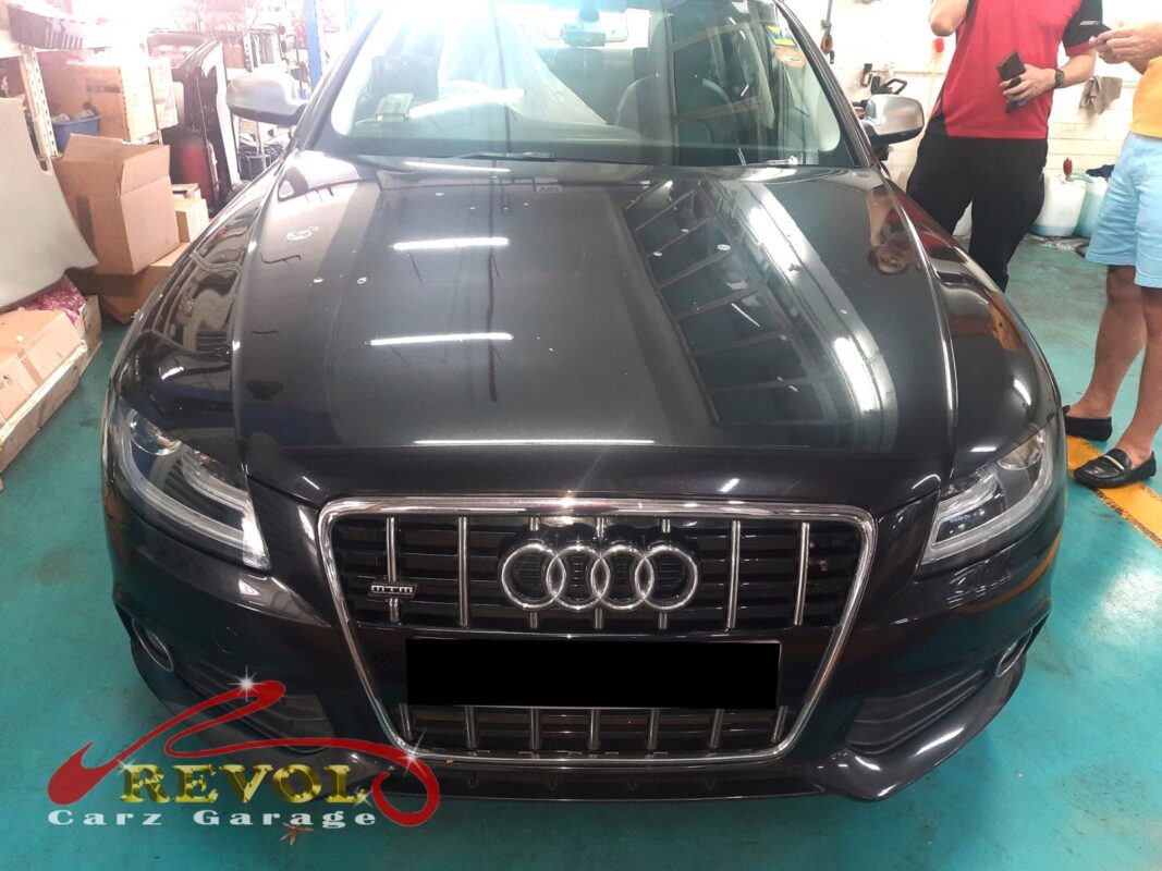 Audi A4 parked at the workshop, in for washer system inspection.