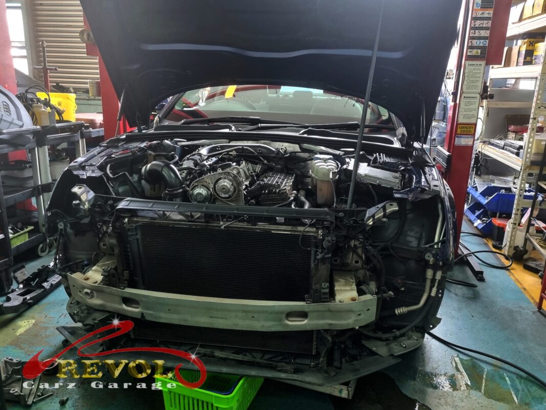The timing covers off on the Audi A4, the old belt exposed.
