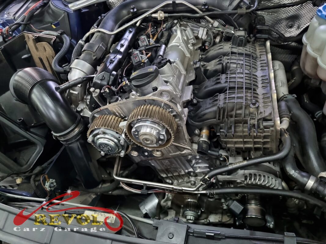 The old timing belt removed showing the glazed, cracking rib face.