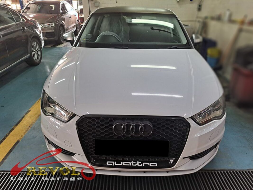 Audi A3 parked at the workshop, in for brake inspection.