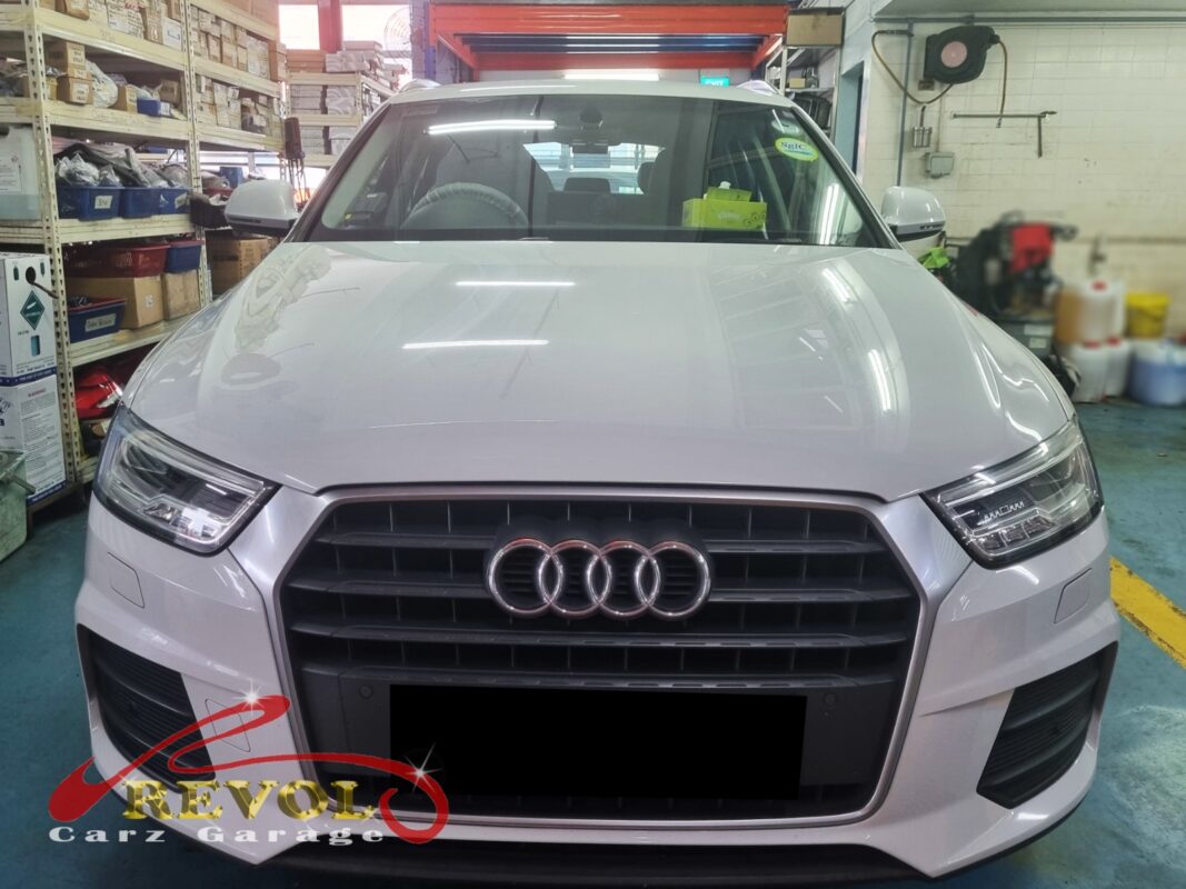 Audi Q3 parked at the workshop, in for front lower arm inspection.