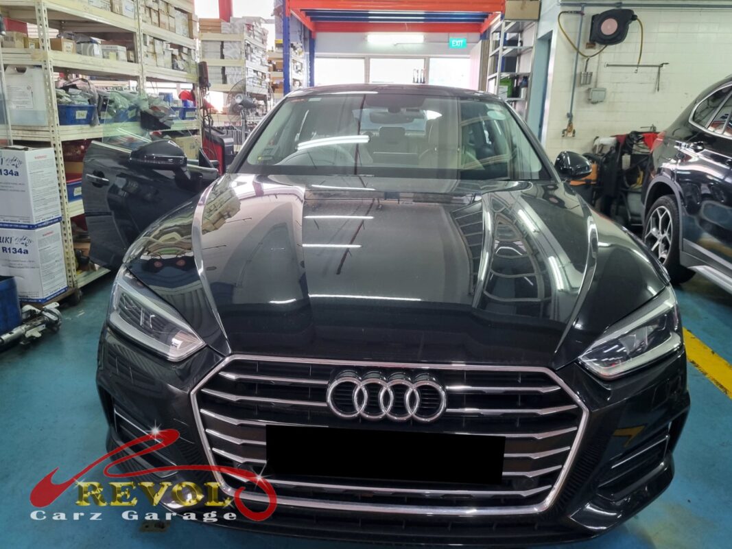 Audi A5 parked at the workshop, in for parking brake button replacement.
