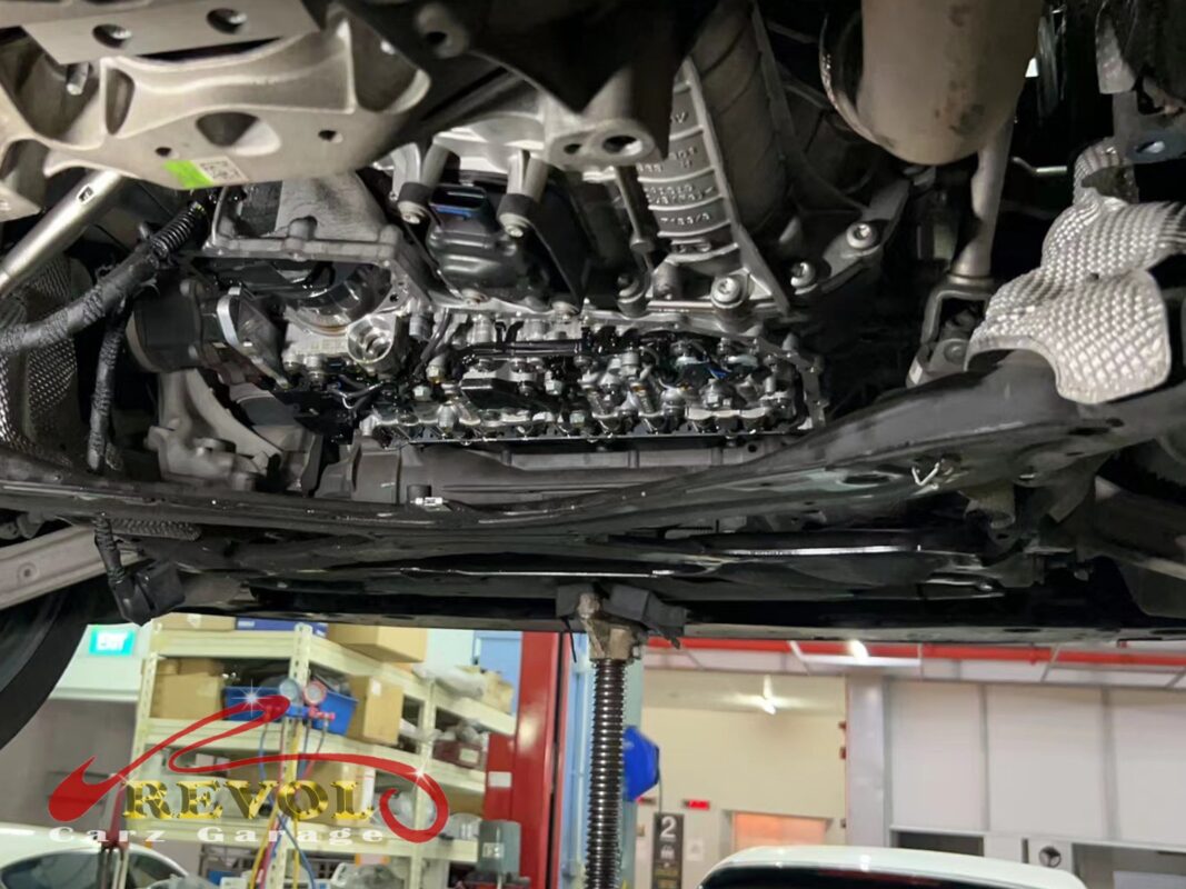 The transmission pan dropped and the old gasket and filter exposed.