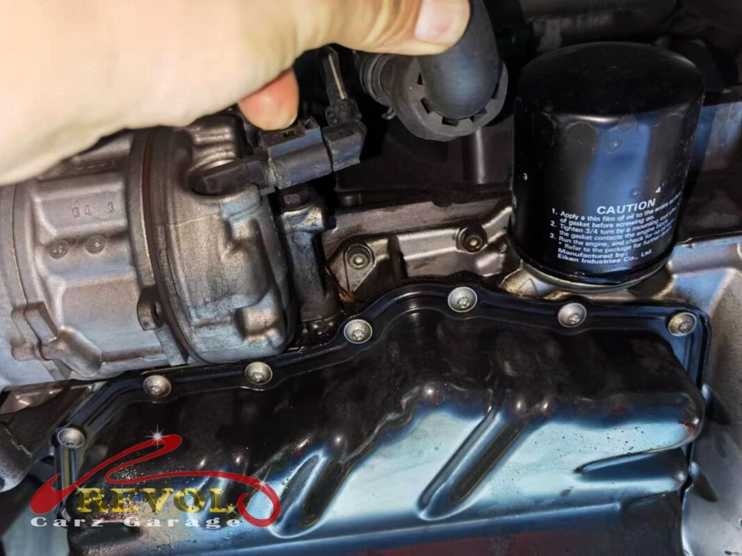 Failed oil separator cover off, diaphragm damage visible.