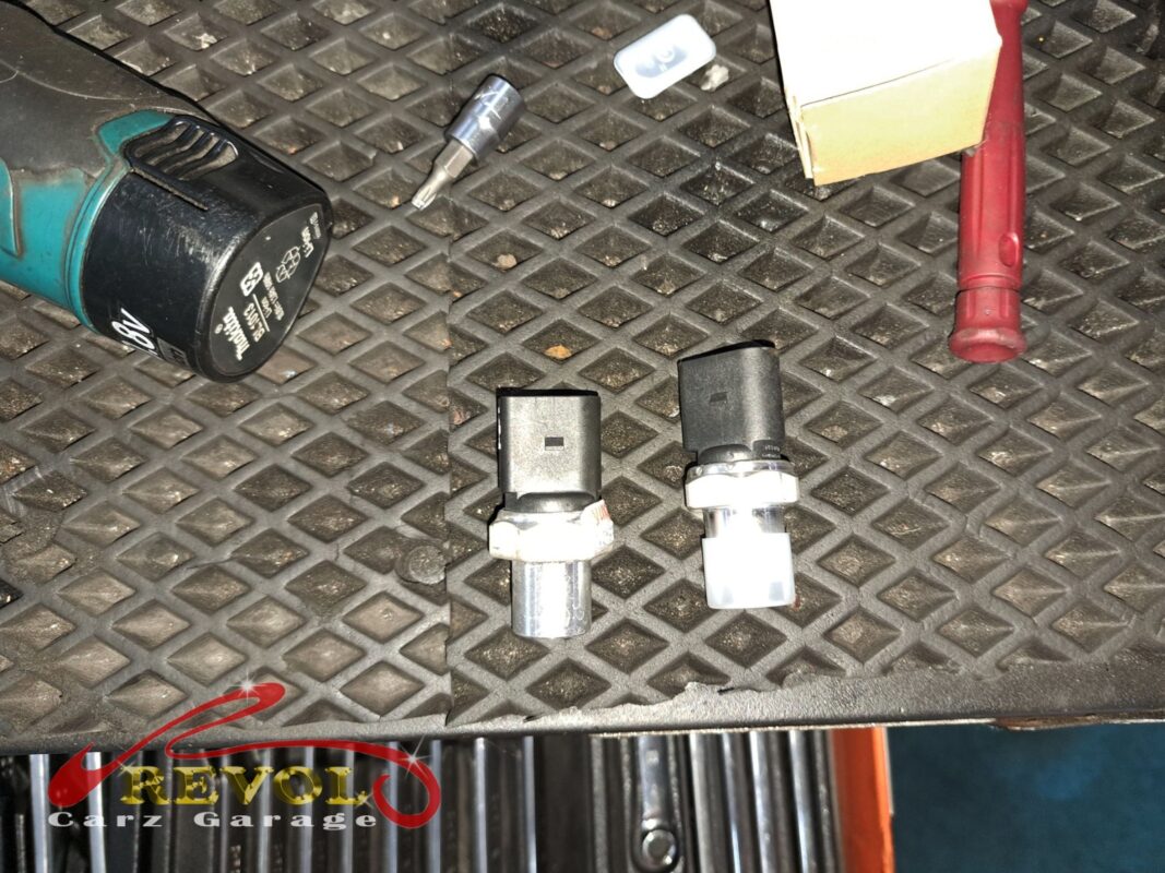AC lines being flushed of metal debris from the failed compressor.