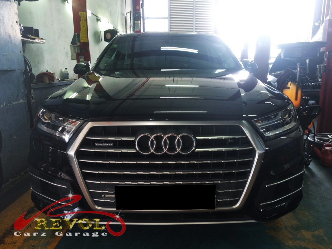 Audi Q7 on the lift for rear shock absorber replacement.