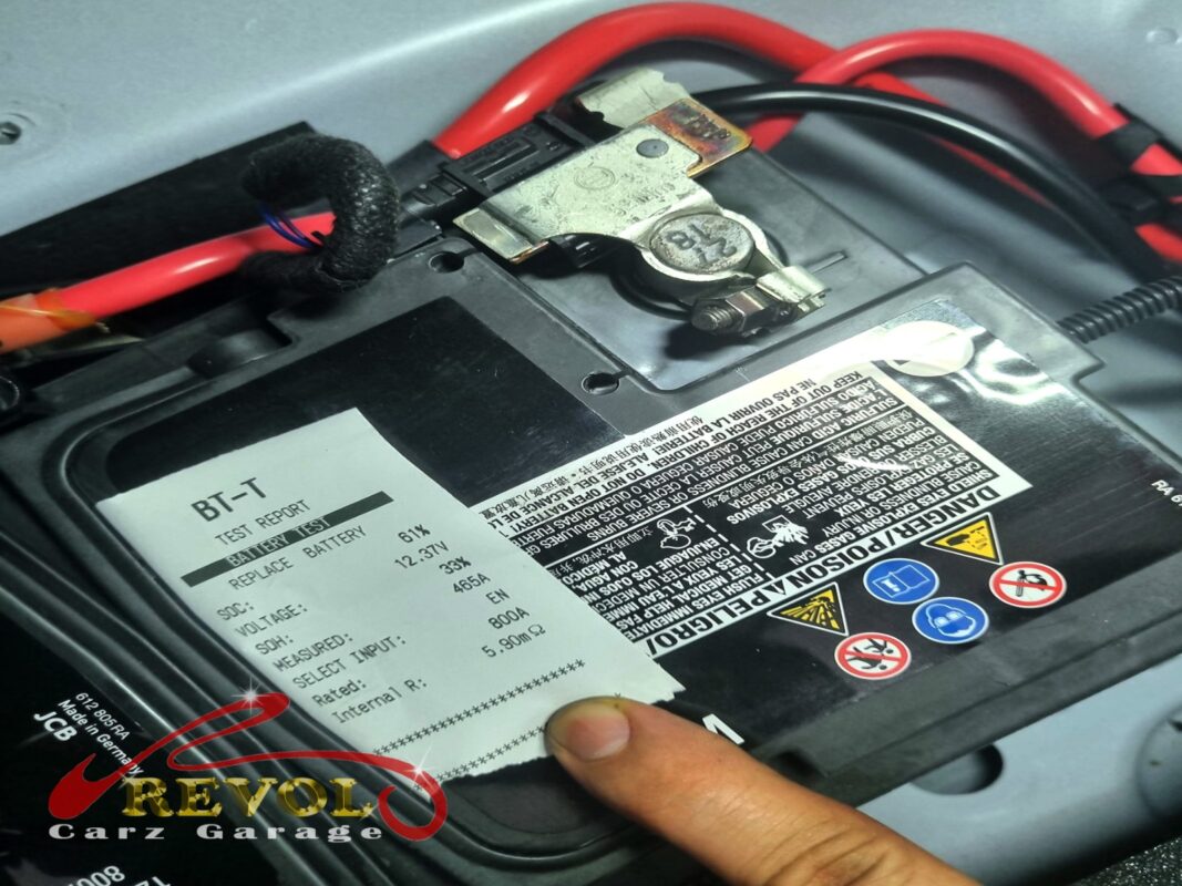 Failed battery lifted out, terminal posts cleaned of corrosion.