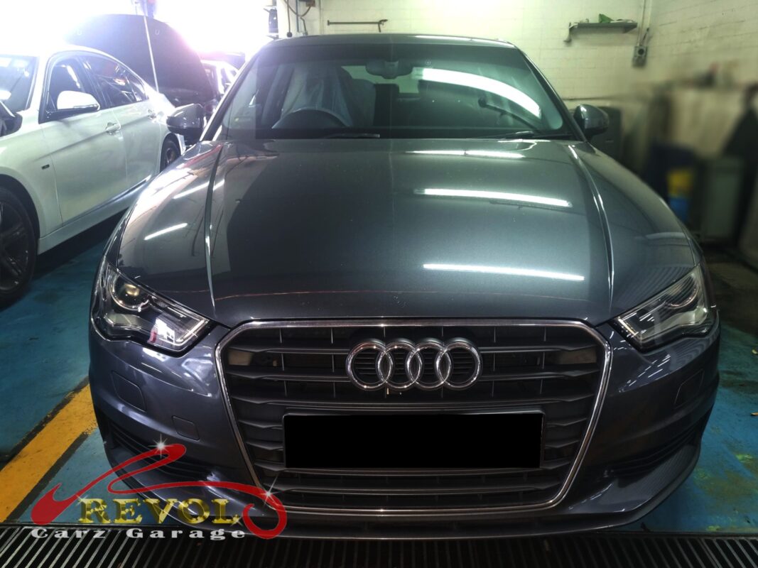 Audi A3 with the engine bay open for water pump replacement.
