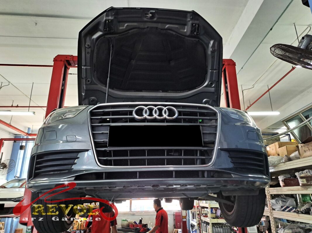 A3 engine bay with the auxiliary belt removed for pump access.