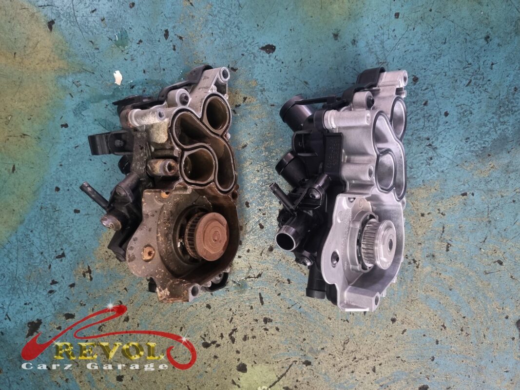 New Audi-spec pump and thermostat ready for installation.