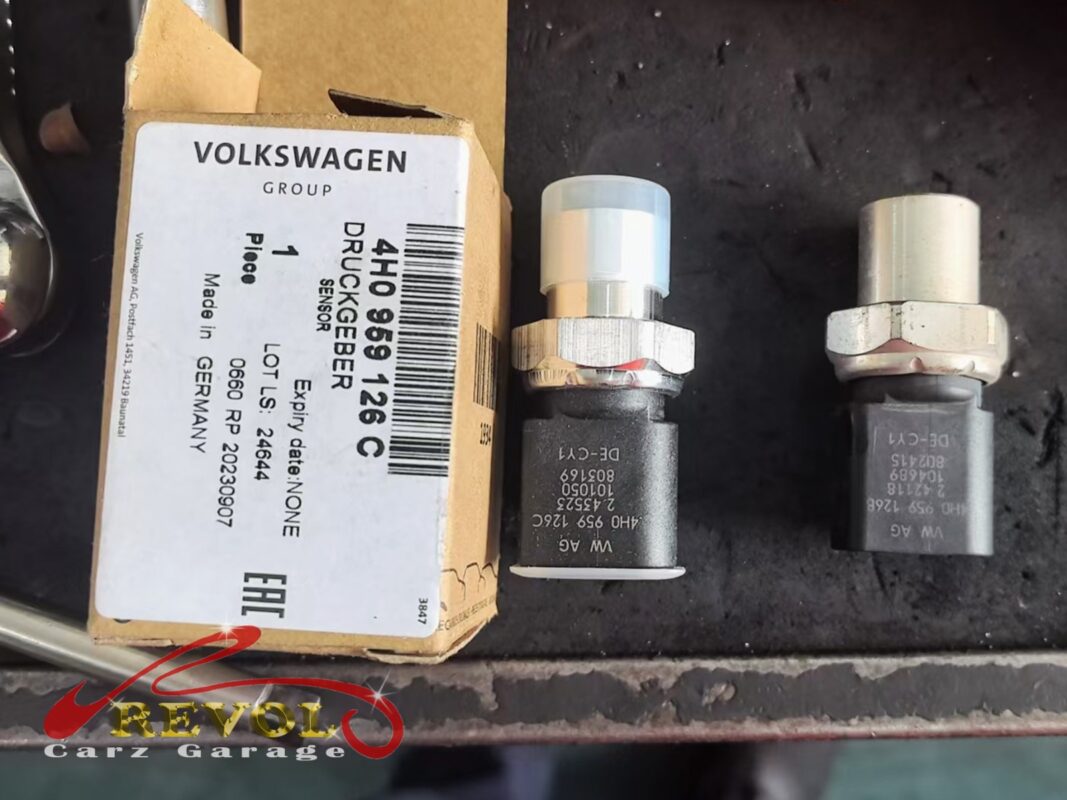 New Audi-spec compressor and receiver-drier ready for installation.