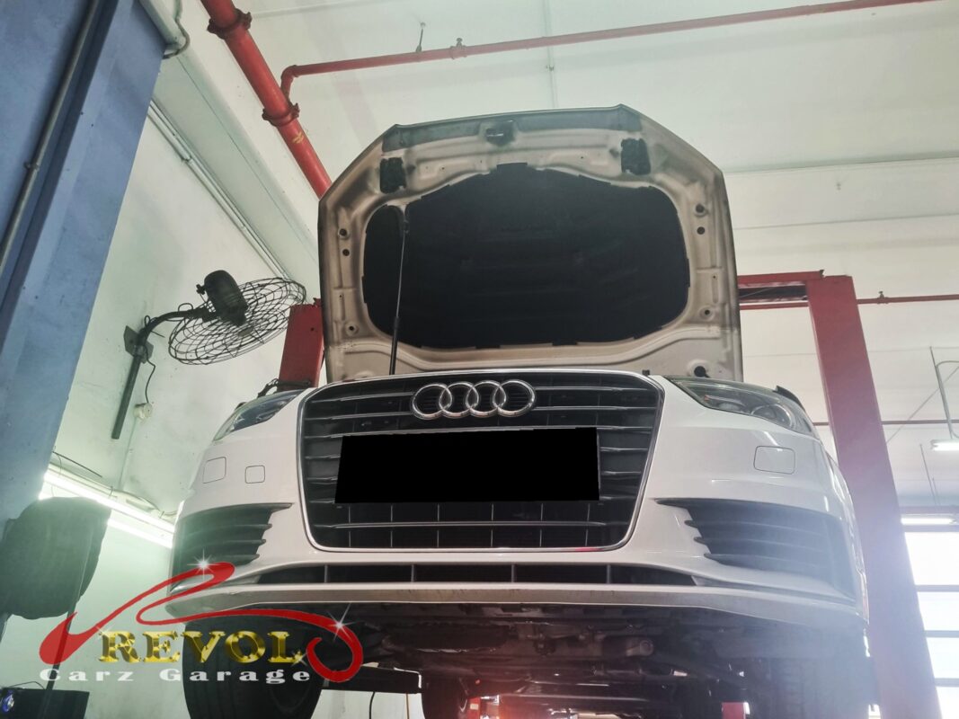 The Audi A3 up on the two-post lift, front end raised for the wheel bearing job.