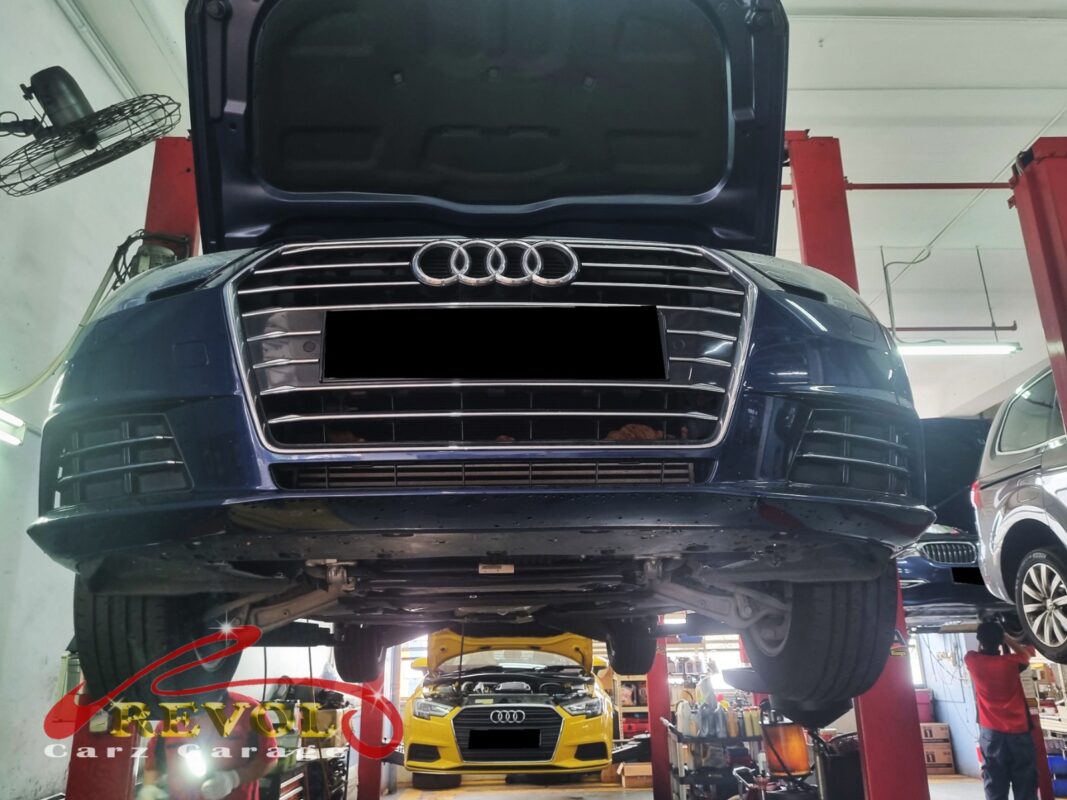 Old upper control arm with visible bush deflection.