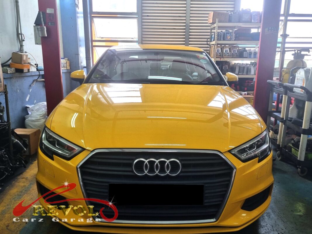 Audi A3 on the workshop lift for fan belt set replacement.