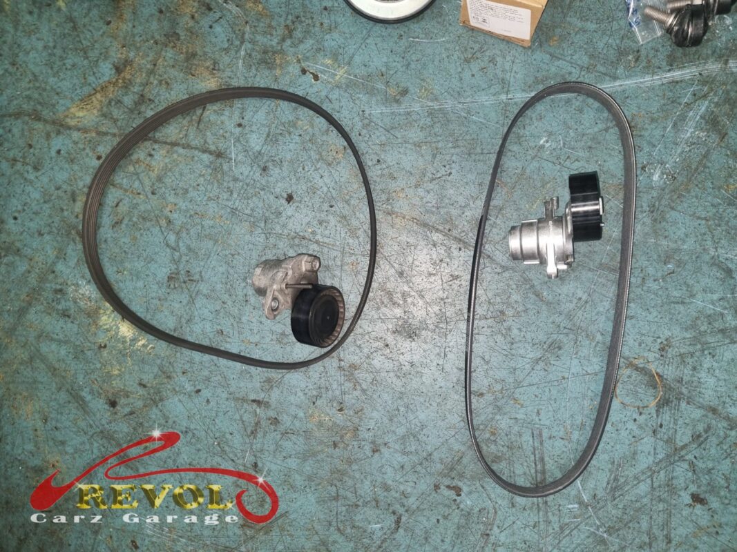 New VAG-spec belt, tensioner, and idler ready for installation.
