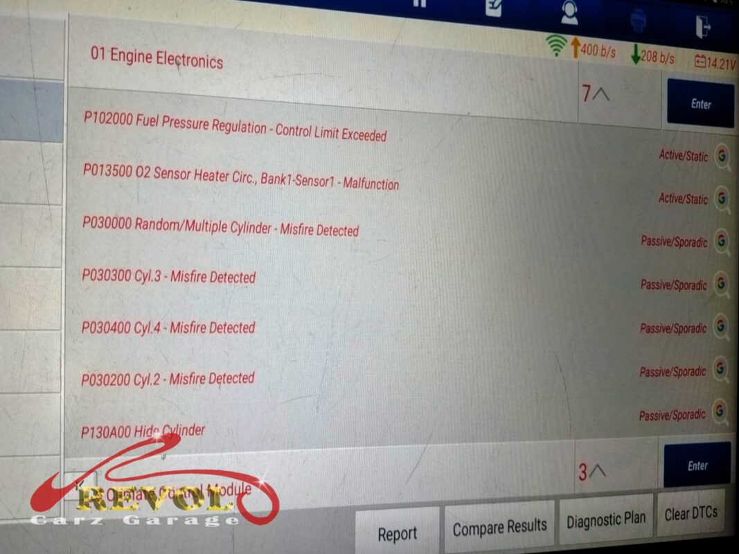 The diagnostic scan on the bay screen: misfire codes flagged across several cylinders, plus an oxygen sensor heater fault and a fuel pressure note.