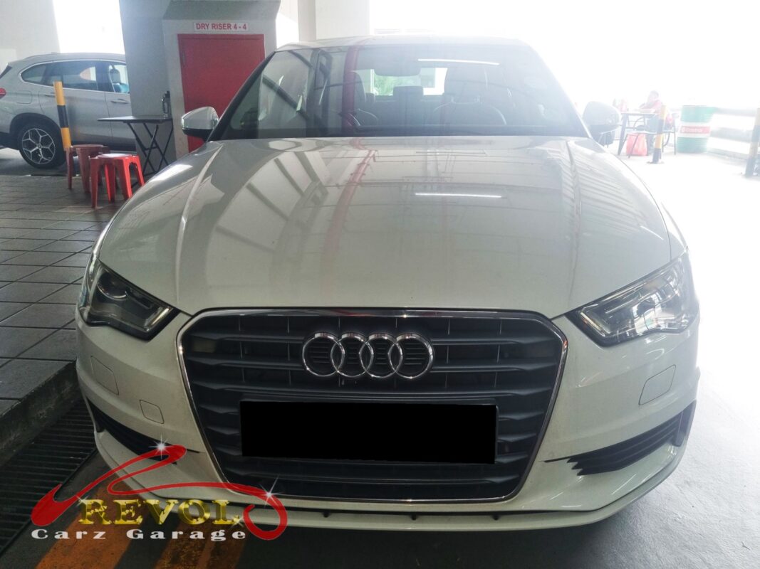 Audi A3 on the workshop lift for water pump replacement.