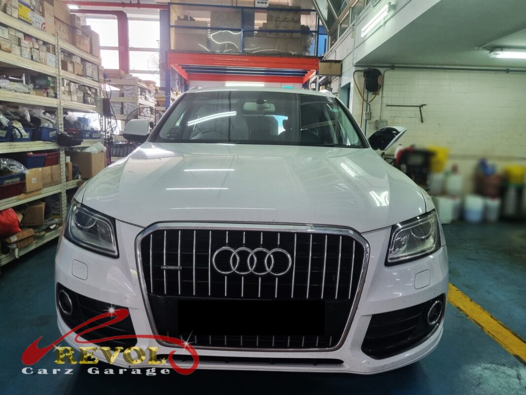 Audi Q5 on the workshop lift for upper control arm replacement.