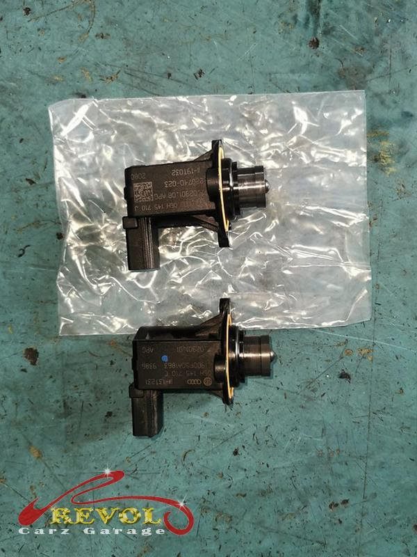 The worn high-pressure fuel pump and cam follower removed.