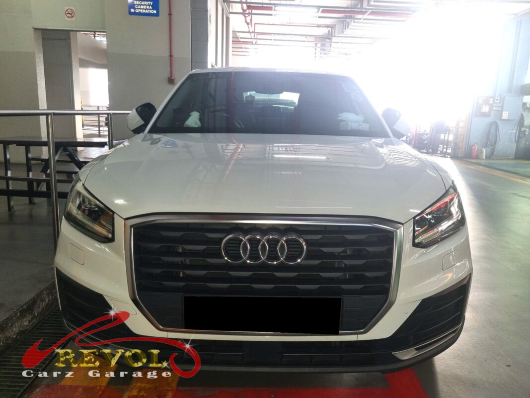 Audi Q2 with the under-dash trim removed for blower motor replacement.