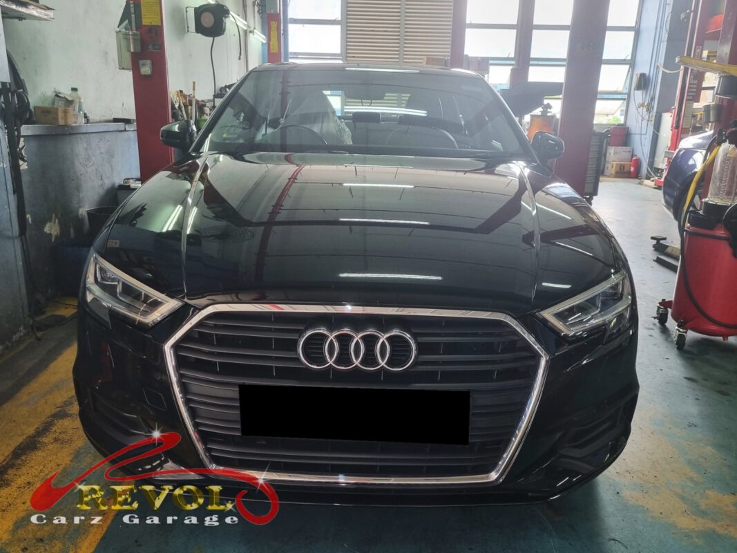 Audi A3 on the workshop lift for front absorber linkage replacement.