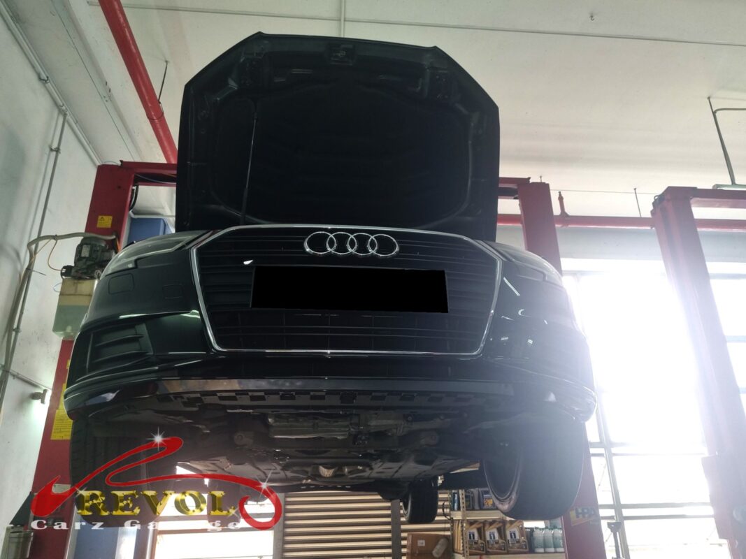 The Audi A3 up on the two-post lift, ready for the suspension work.