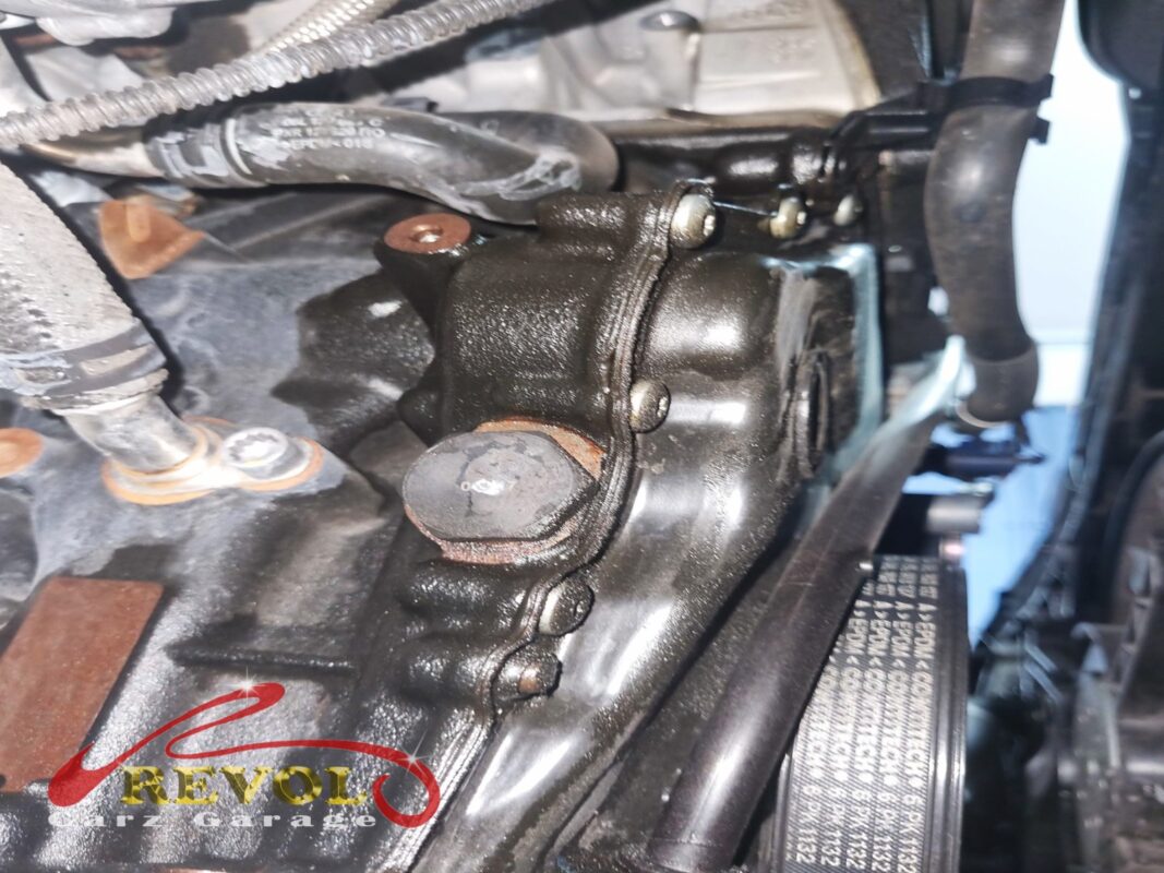 The oily mess around the timing cover before the strip-down. The hardened gasket had been weeping engine oil down the front of the block.