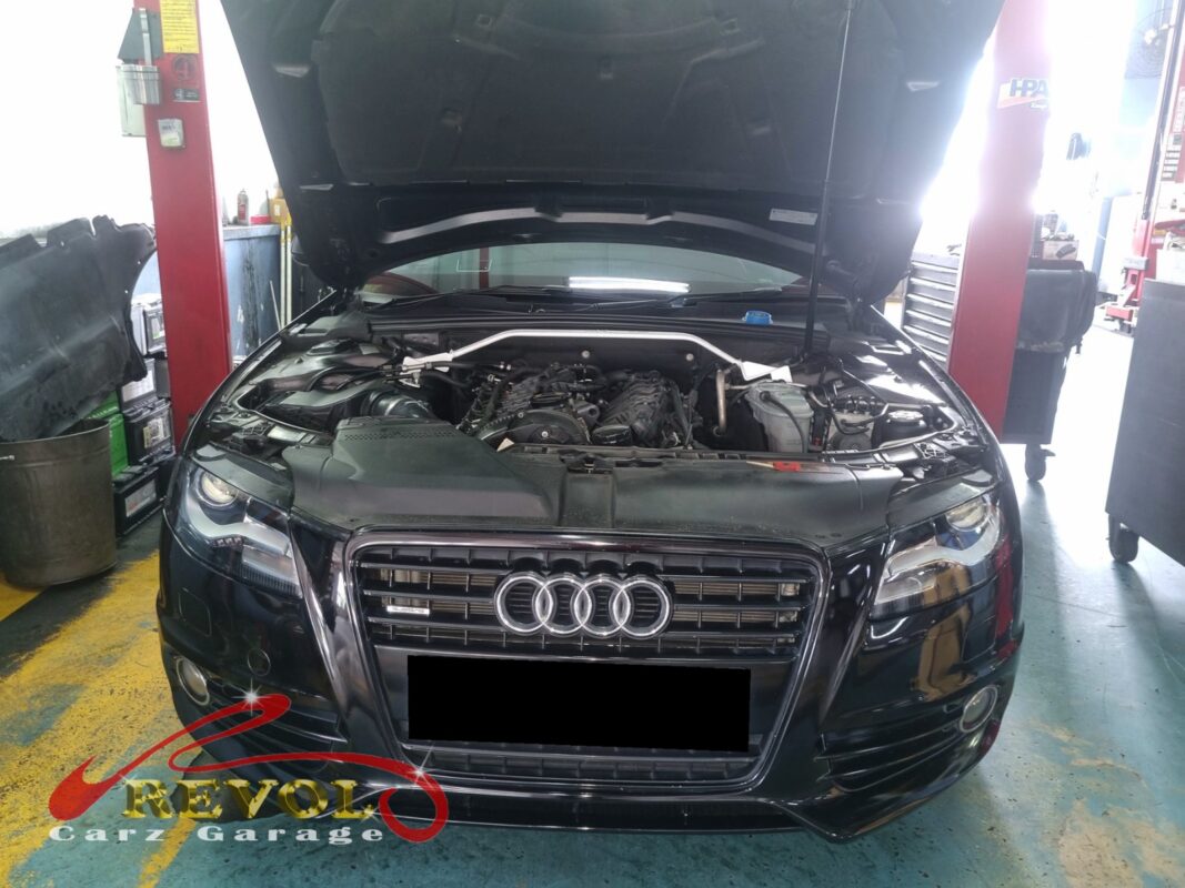 Audi A4 on the workshop lift for oil sump replacement.