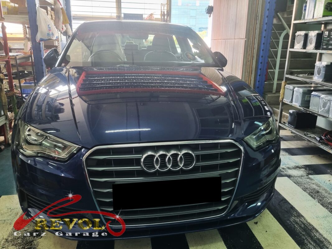 Audi A3 on the workshop lift with the front subframe partially dropped for bushing replacement.