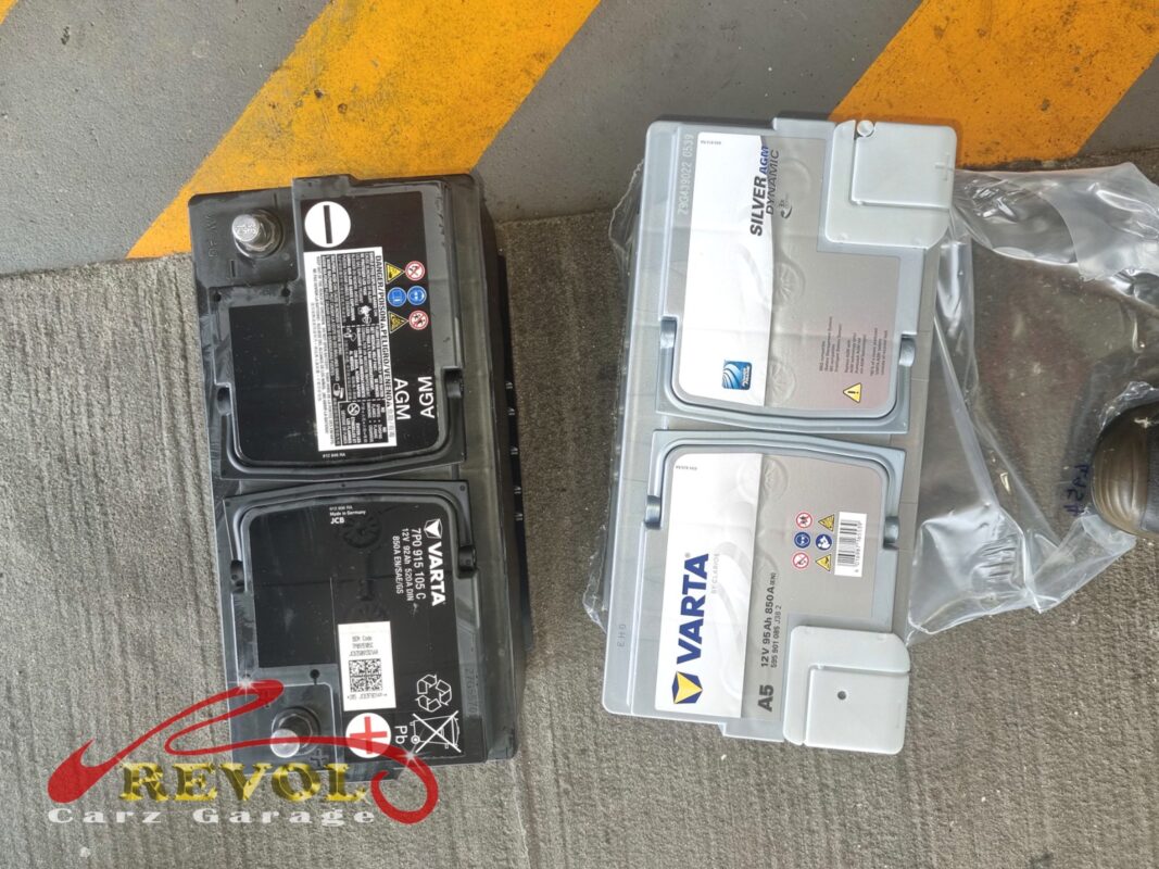 The old AGM battery (left) out, the new VAG-spec AGM unit (right) ready to go in.