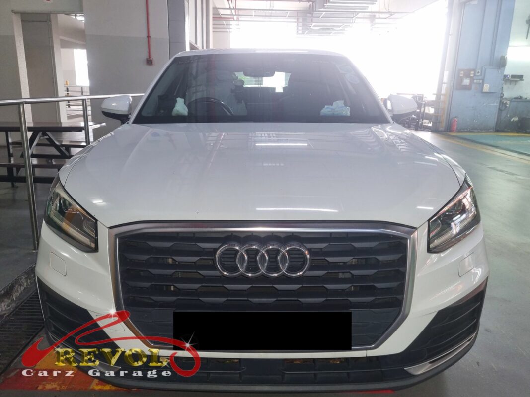 Audi Q2 with the engine cover off for oil separator replacement.