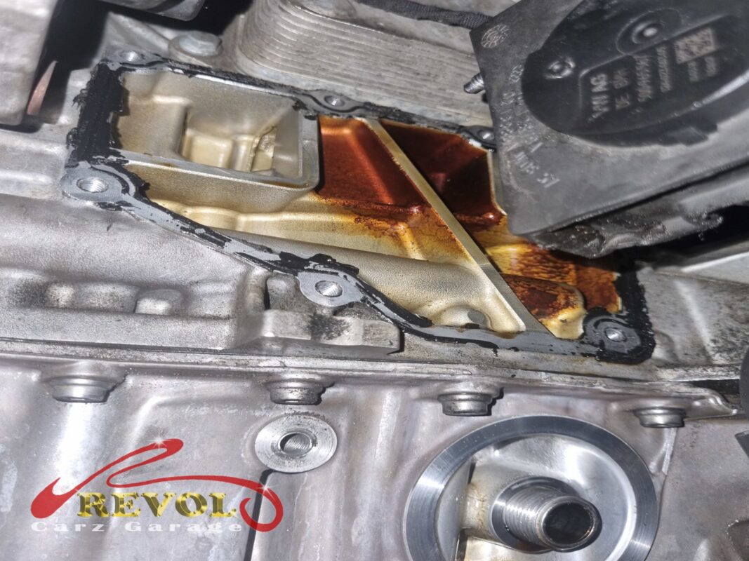 The separator off, showing its mounting face on the block. The timing chain is visible through the opening.