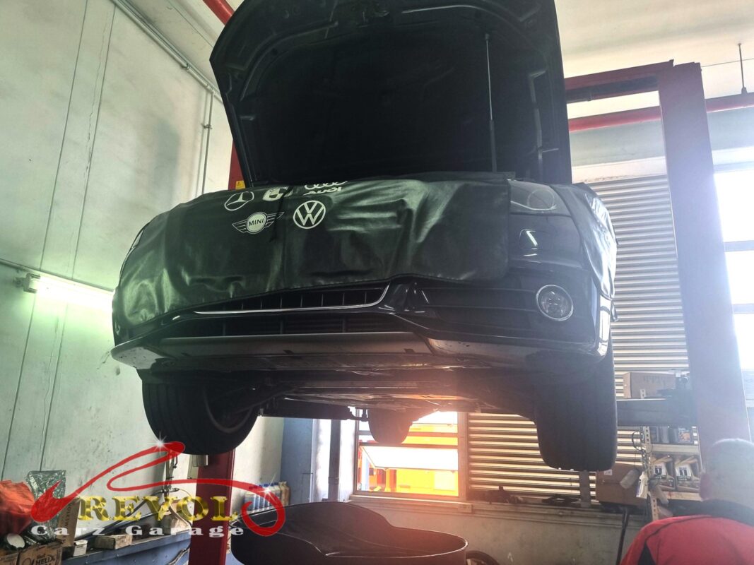 The Audi A4 up on the two-post lift, fender cover on, in for the intake manifold work.