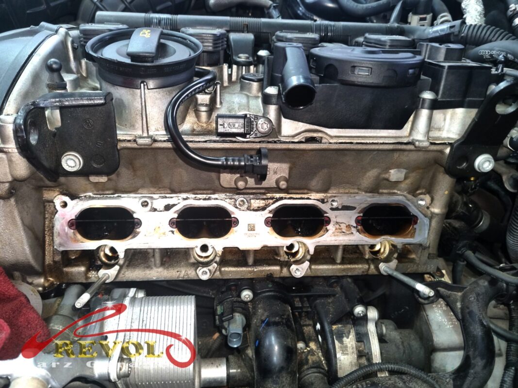 The intake manifold off, the four cylinder-head ports exposed with a fresh gasket in place, ready for the new manifold.