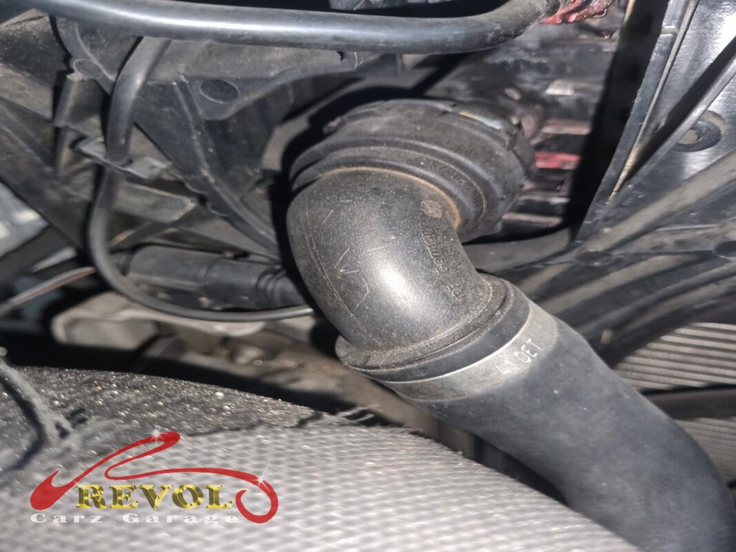 A coolant hose in the engine bay, the kind of area that gets a careful look when a car is losing coolant.