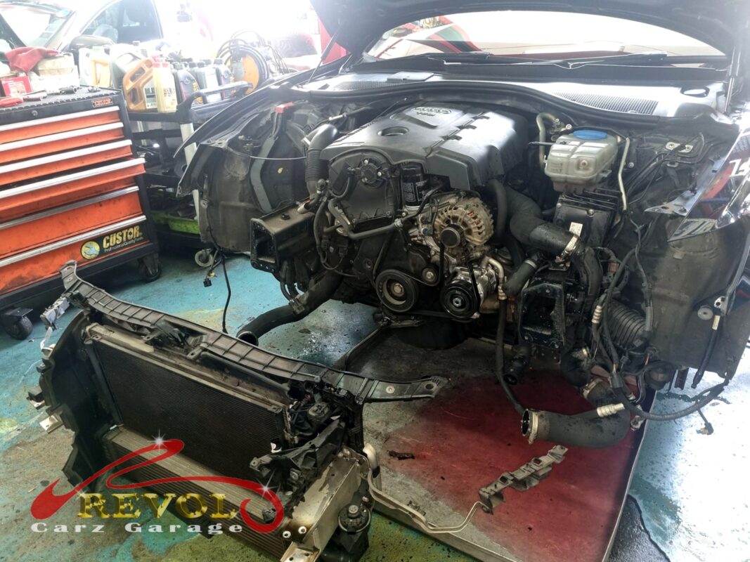 The A6 with the front end stripped, the radiator support and bumper off so the radiator could come out.