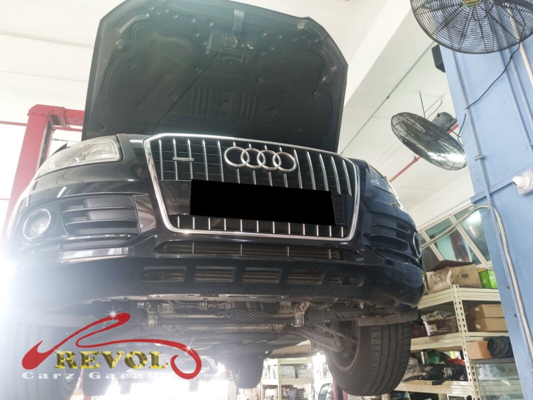 The Audi Q5 up on the two-post lift, in to track down the misfire.
