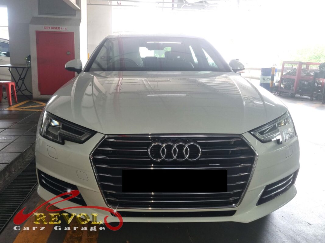 Audi A4 on the workshop lift for ATF oil pan replacement.