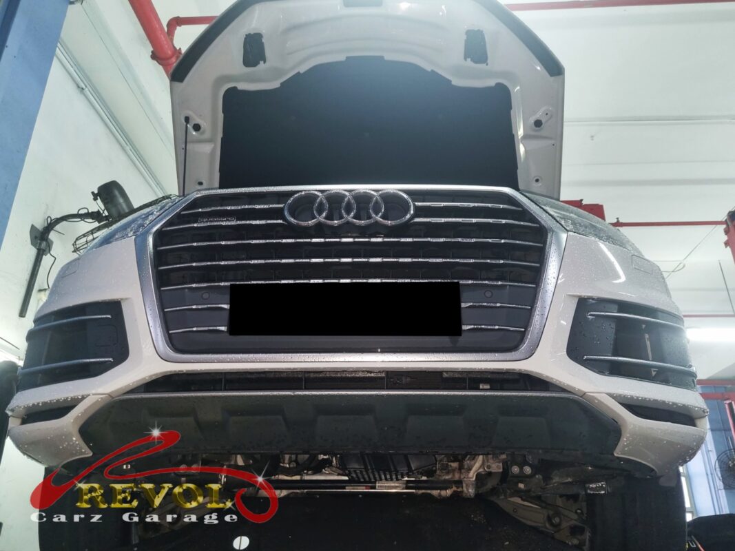 The Audi Q7 up on the two-post lift, in for the cooling system job.